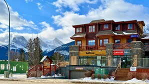 A multi-story hotel with a ski resort view, featuring signage for Saffron, Rogers, and fido.