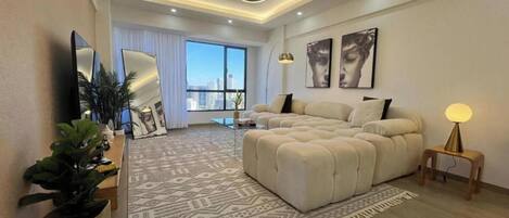 Deluxe Apartment | Living area | Flat-screen TV