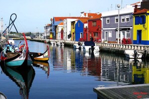 A canal with colorful buildings and boats. - House With Heated Pool all Year Round (Murtosa)