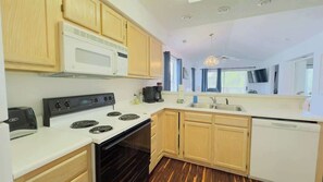 Microwave, coffee/tea maker, toaster, cookware/dishes/utensils