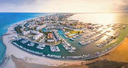 Semi detached villa with private fenced garden in Lignano Pineta