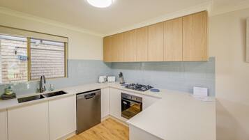 Coffee/tea maker, fridge, microwave, oven