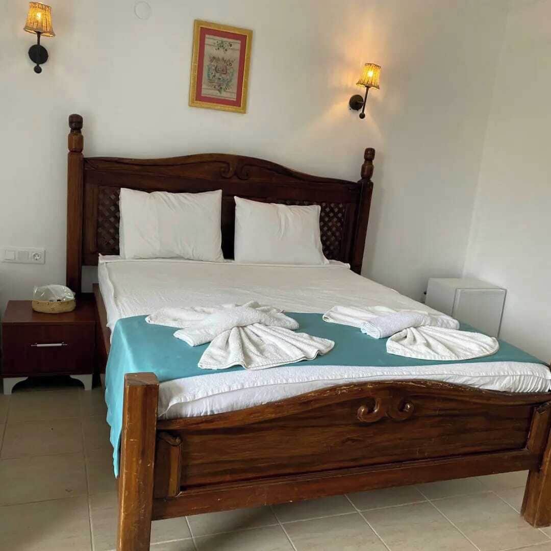 Habitación cuádruple estándar, varias camas, vista al jardín, frente al mar | Ropa de cama 
