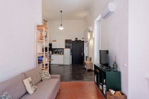 Standard Apartment, City View | Living area | 43-inch flat-screen TV with digital channels
