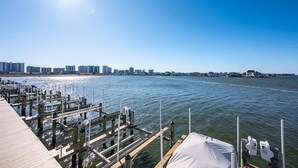 A waterfront dock with a clear view of a city skyline in the background.
