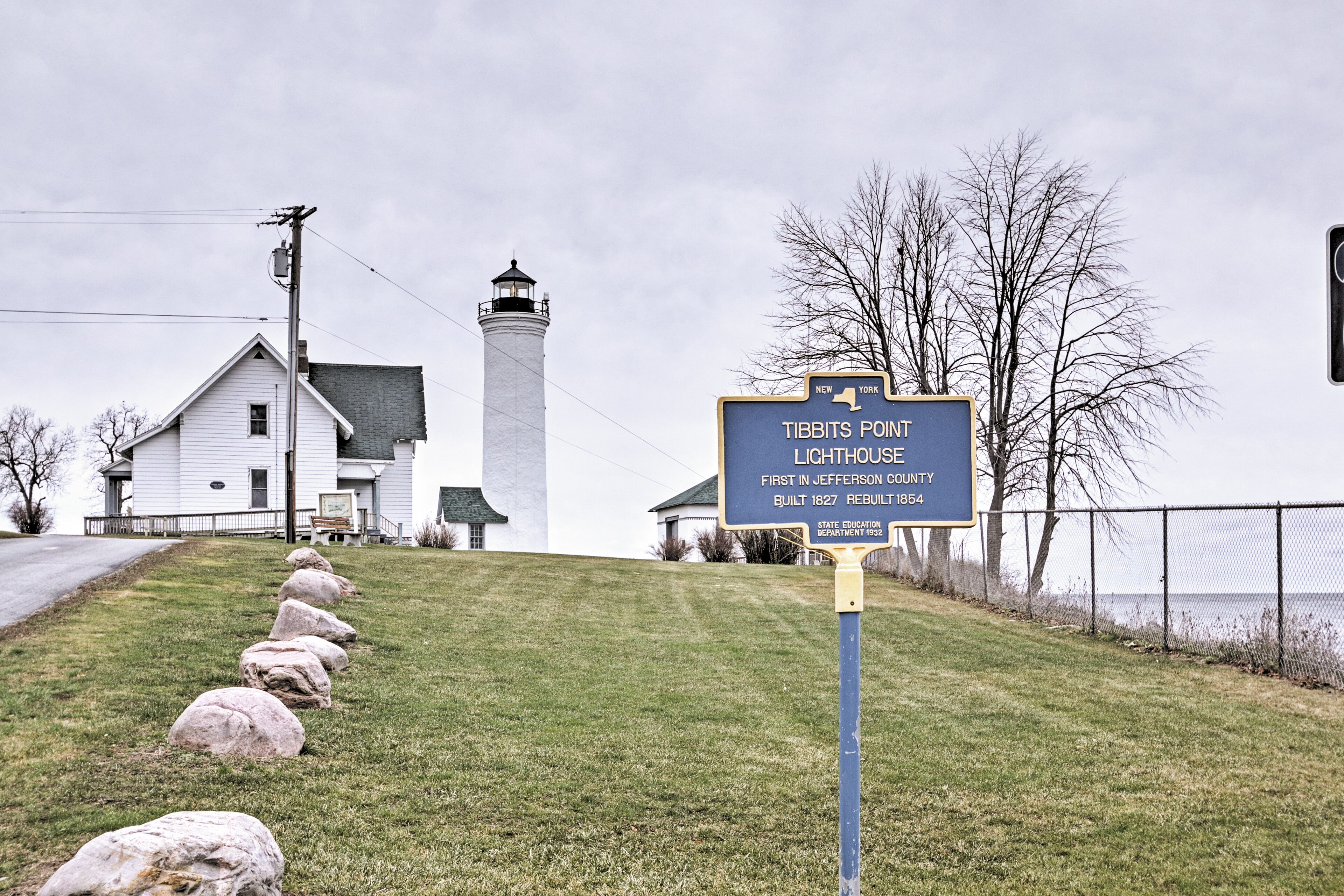 A lighthouse sign with historical information.