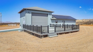 A single-story building with a garage and a covered porch area.