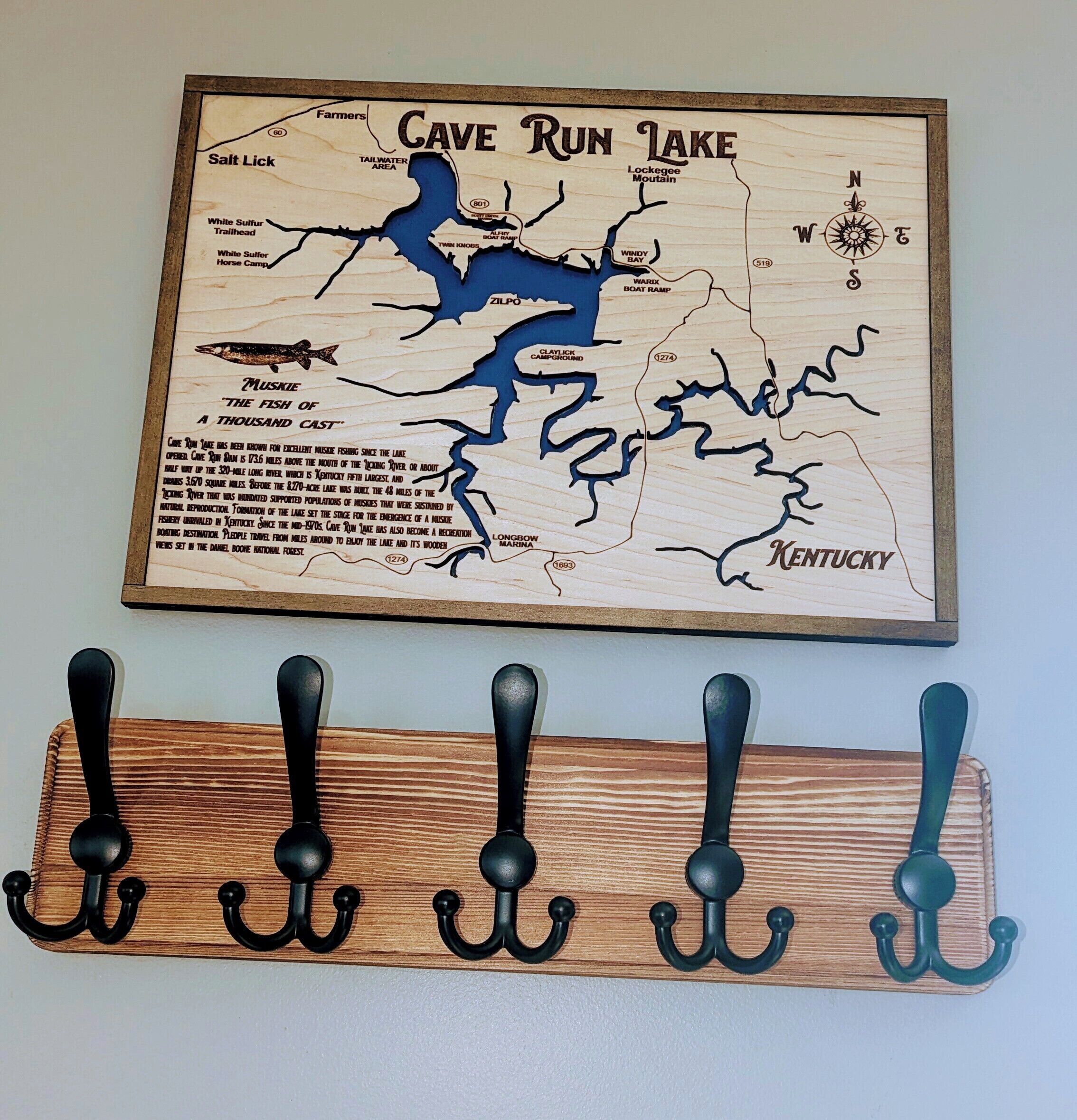 A map of Cave Run Lake with a wooden rack below it.