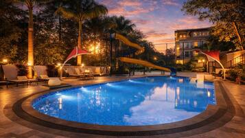 Outdoor pool, open 7:00 AM to 6:00 PM, pool loungers