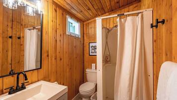 Shower, hair dryer, towels, shampoo