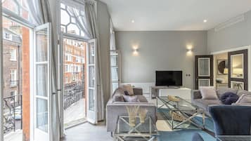 Superior Apartment | Living area | 40-inch Smart TV with digital channels