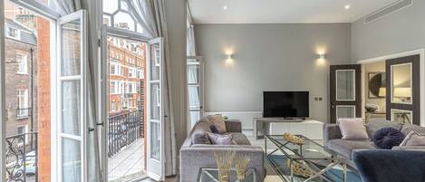 Superior Apartment | Living area | 40-inch Smart TV with digital channels