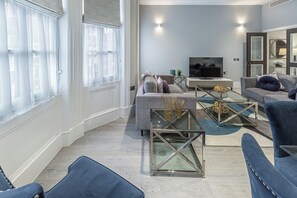 Superior Apartment | Living area | 40-inch Smart TV with digital channels