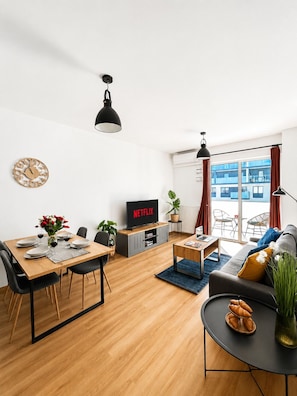Comfort Apartment, City View | Living area | TV