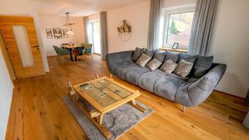 Comfort Apartment, 3 Bedrooms, Balcony, Mountain View | Living area | 50-inch flat-screen TV with cable channels