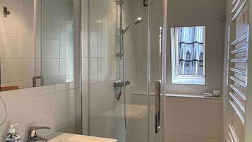 Shower, hair dryer, towels, shampoo