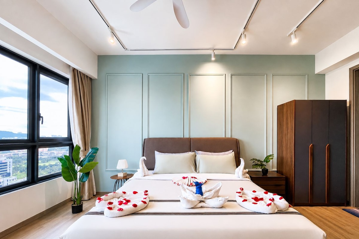 A modern hotel room with a large bed, a wardrobe, a nightstand, and a view of the city.