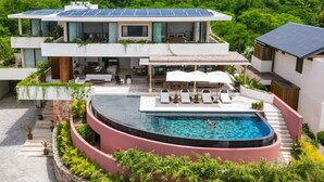 A modern two-story house with a swimming pool and solar panels. - Staffed villa in gated community - Punta Mita Corridor (La Cruz de Huanacaxtle)