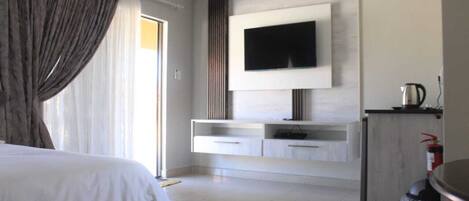 Desk, laptop workspace, blackout curtains, iron/ironing board