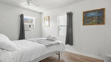 1 bedroom, desk, iron/ironing board, travel crib