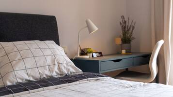 1 bedroom, desk, iron/ironing board, travel crib