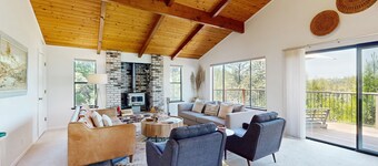 Modern home w/ peekaboo lake views, close to marina, two fireplaces, & WiFi