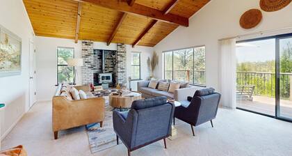Modern home w/ peekaboo lake views, close to marina, two fireplaces, & WiFi