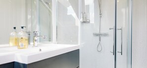 Shower, hair dryer, towels, soap