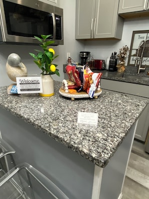 Fridge, microwave, stovetop, coffee/tea maker