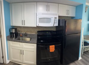 Fridge, microwave, stovetop, coffee/tea maker