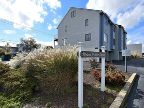 A building with a sign reading 'Beach Pebble Square.'