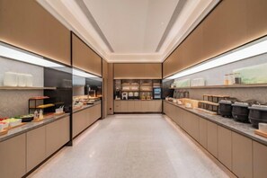 A modern kitchen with a central island, built-in appliances, and ample counter space. - Palace Hot Spring Hotel (Beijing Changping Xiaotangshan Hot Spring Resort) (Beijing)