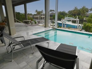 Outdoor pool, a heated pool - Charming Home Waterfront and Pool. (Naples)