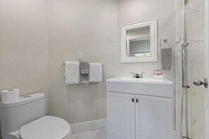 Shower, hair dryer, towels, soap