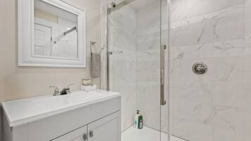 Shower, hair dryer, towels, soap