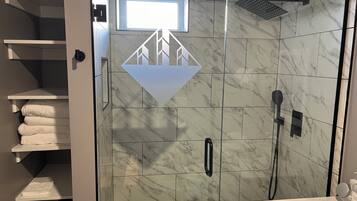 Shower, towels, soap, toilet paper