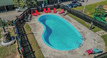 Seasonal outdoor pool, open 9:00 AM to 8:00 PM, pool umbrellas