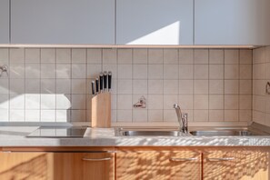 Fridge, microwave, stovetop, coffee/tea maker