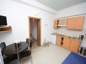 Apartment (One Bedroom Apartment 5) | Living room | 32-inch flat-screen TV with cable channels