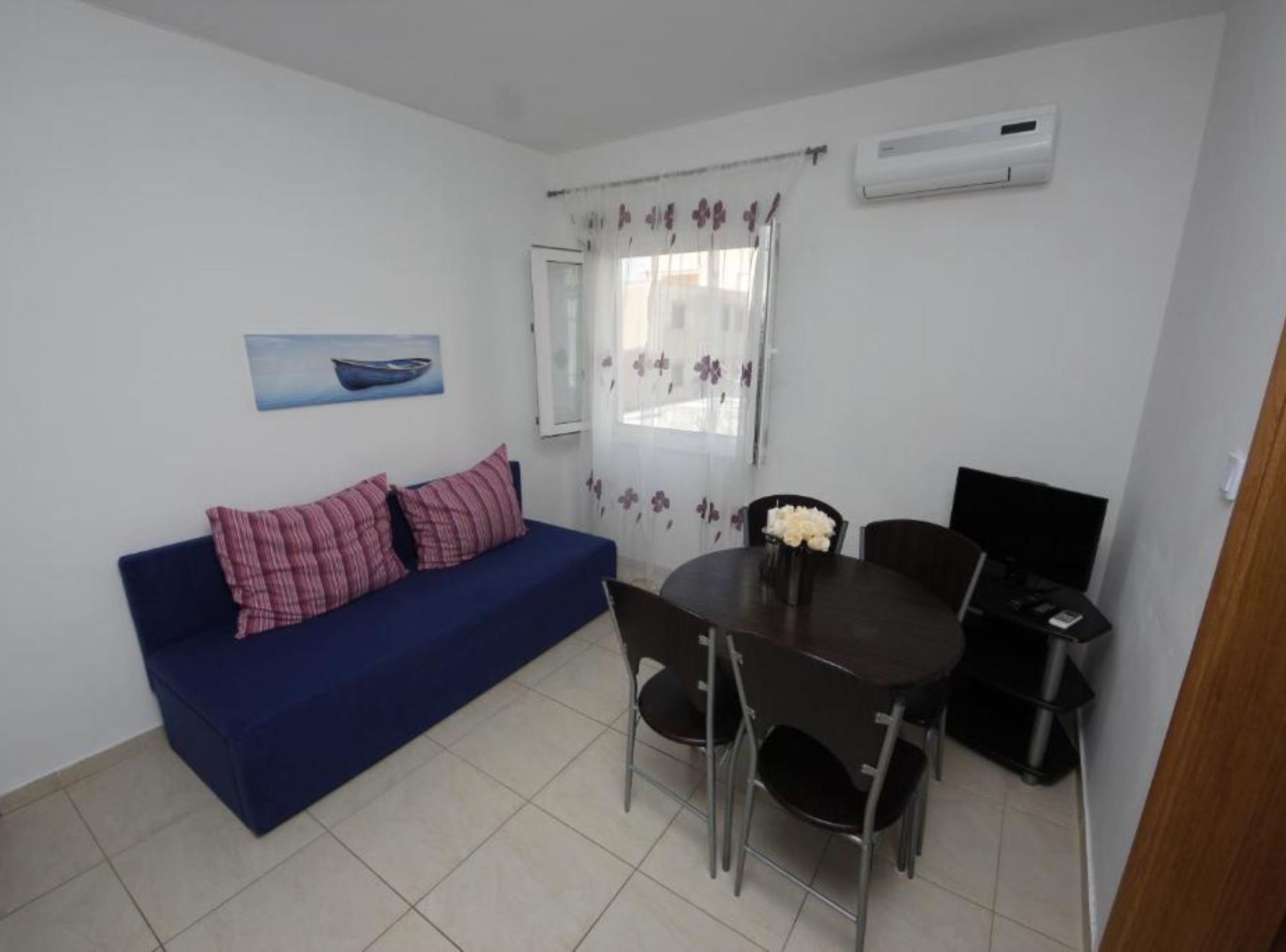 Apartment (One Bedroom Apartment 6) | Living room | 32-inch flat-screen TV with cable channels