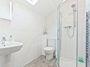 A modern bathroom with a glass-enclosed shower, a white sink, and a toilet. - 3 bedroom accommodation in Arnside, near Carnforth (Arnside, near Carnforth)