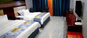Kuqa Xinyu Hotel (Guiz Plaza)