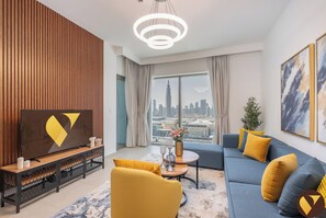Luxury Apartment, City View | Living area | 55-inch Smart TV with cable channels