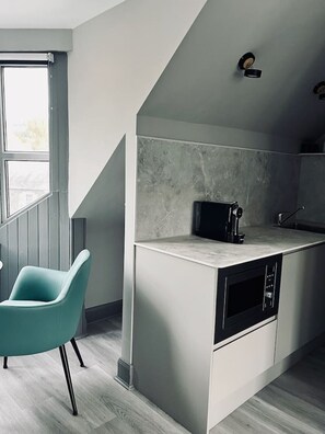 Microwave, stovetop, coffee/tea maker, cookware/dishes/utensils