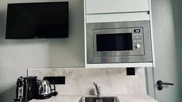 Fridge, microwave, stovetop, coffee/tea maker