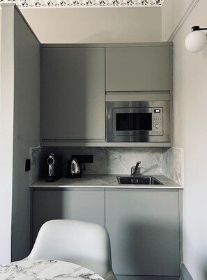 Fridge, microwave, stovetop, coffee/tea maker