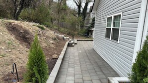 A paved pathway leading to a house with a stone border and potted evergreen trees. - Newly renovated 3 bed 2 bath house in Clifton Forge, Va (Clifton Forge)