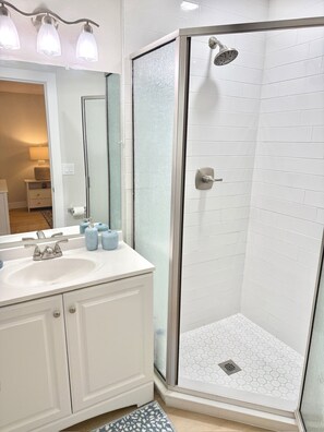 Shower, hair dryer, towels, soap
