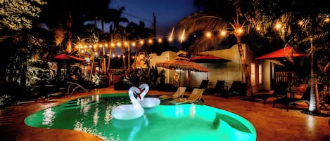 Outdoor pool, open 9:00 AM to 9:00 PM, pool umbrellas, pool loungers