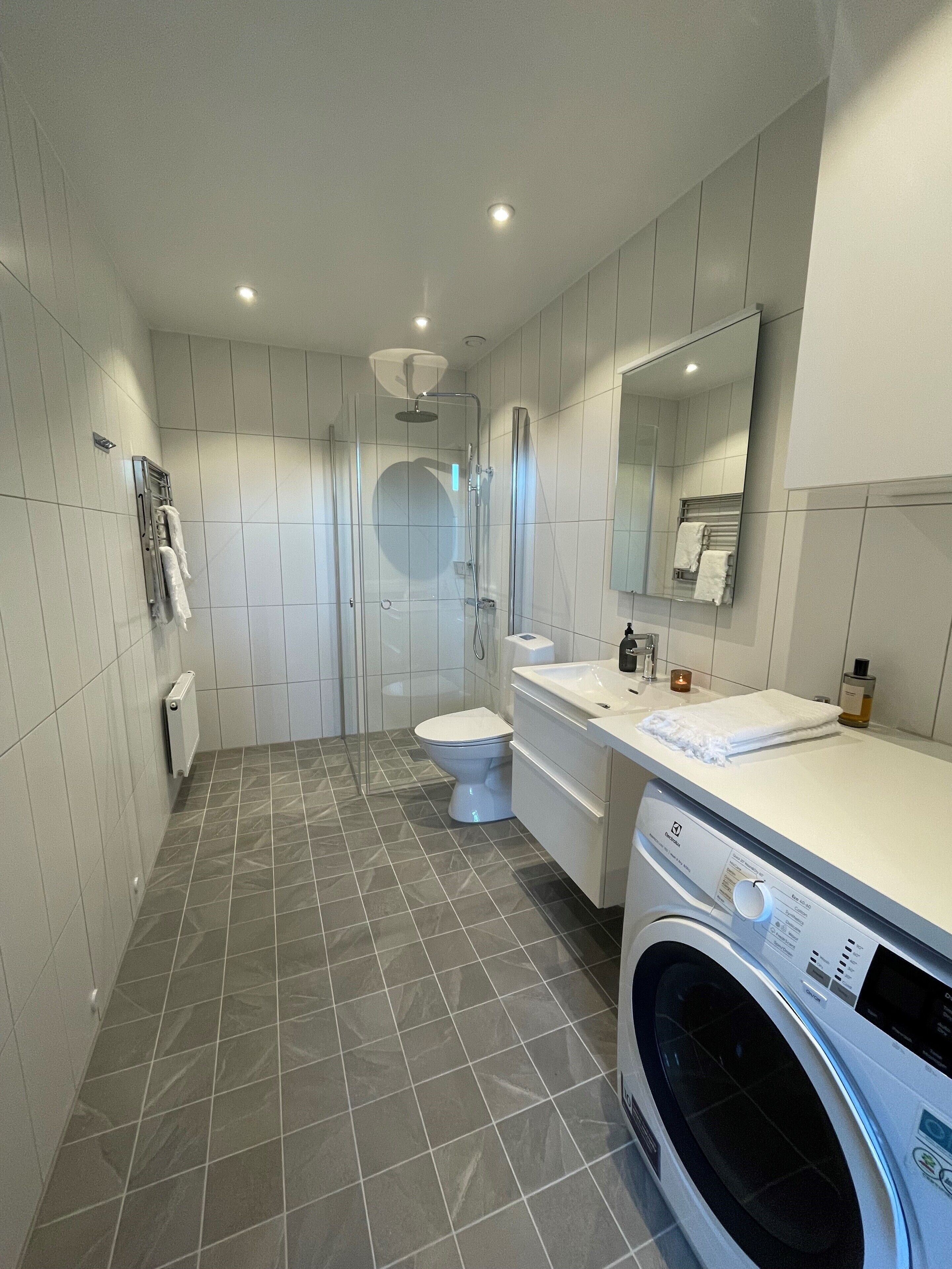 Shower, hair dryer, towels, soap